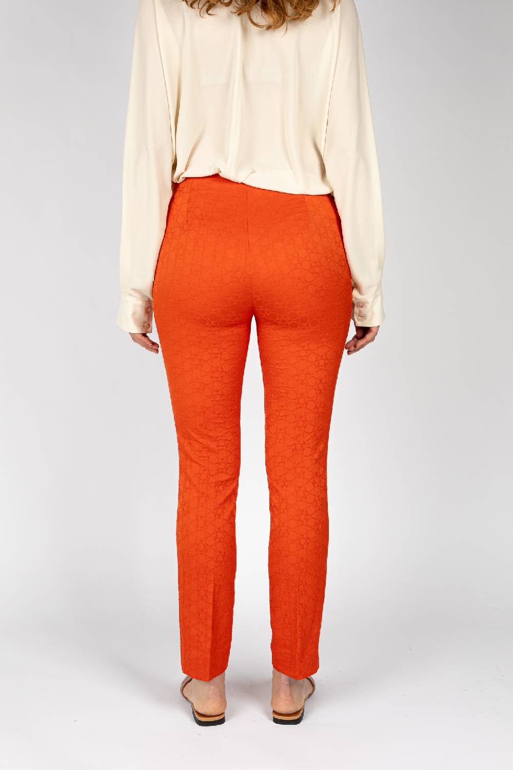 L.Pucci Pantaloni jacquard a fiore colore arancio, linea stretta Sottocosto