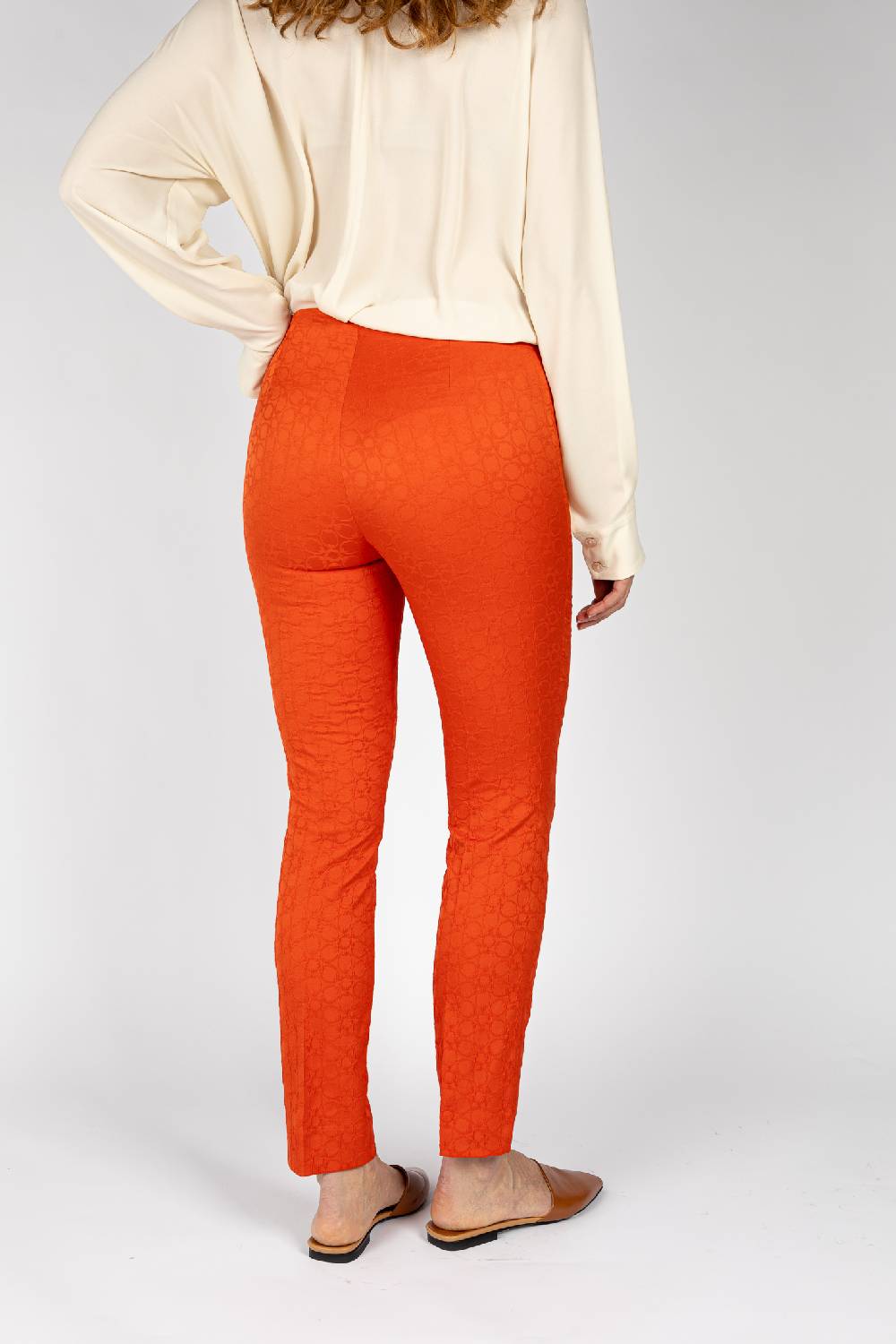 L.Pucci Pantaloni jacquard a fiore colore arancio, linea stretta Sottocosto