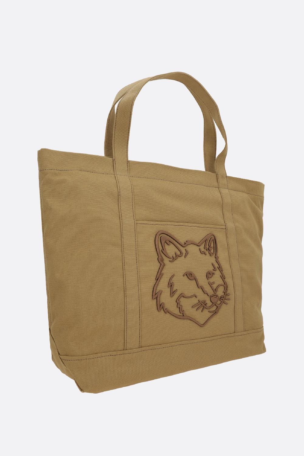 MAISON KITSUNÉ borsa tote Fox Head large in canvas Comprane uno, ottenene uno gratis